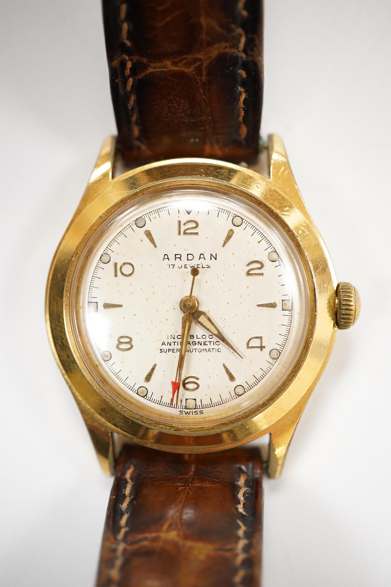 A gentleman's mid 20th century steel and gold plated Arden 'Super Automatic' wrist watch, with baton and Arabic numerals and seep seconds with red arrow pointer, case diameter 33mm, on an Omega brown leather strap.